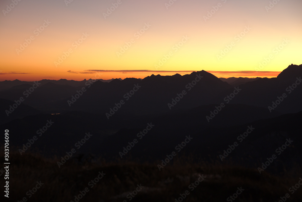 Sunrise above mountain range in the Alps