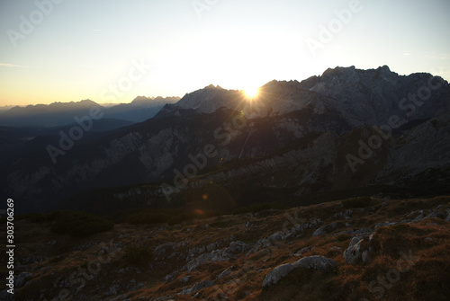 Sunrise above mountain range in the Alps
