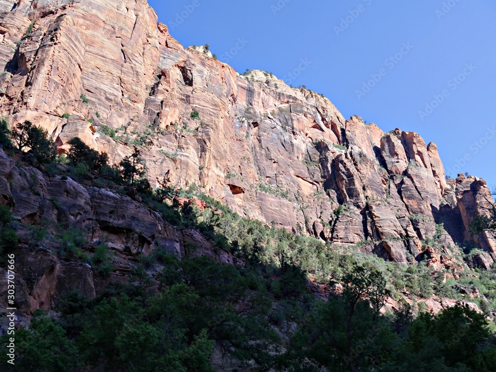 Upward shot of textured rugged cliff sides at Zion National Park, Utah