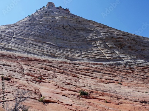 Close upward shot of textured steep red cliffs at Zion National Park, Utah