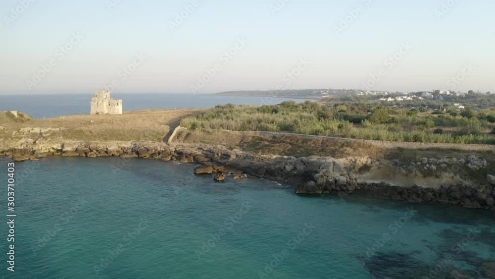 Aerial shot of coastline with a small castle on the beach, Puglia. Italy Aerial shot of coastline with a small castle on the beach, Puglia. Italy