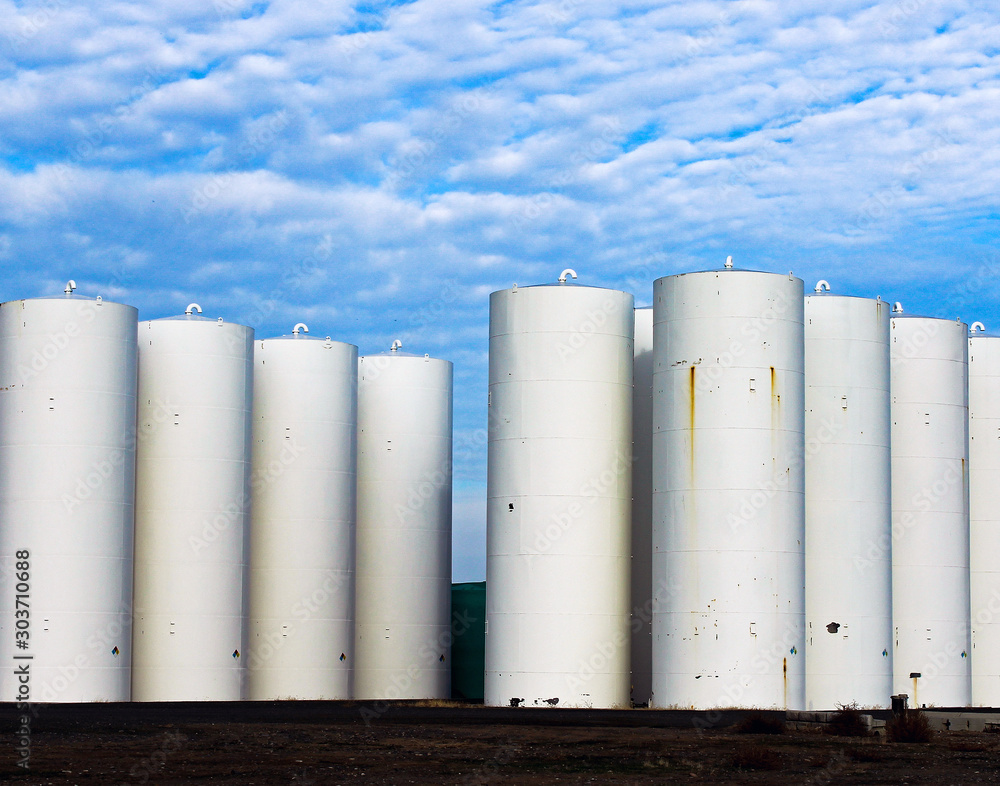 Grain Silos in Southeastern Washington State under a blue sky with clouds Grain Silos in Southeastern Washington State under a blue sky with clouds