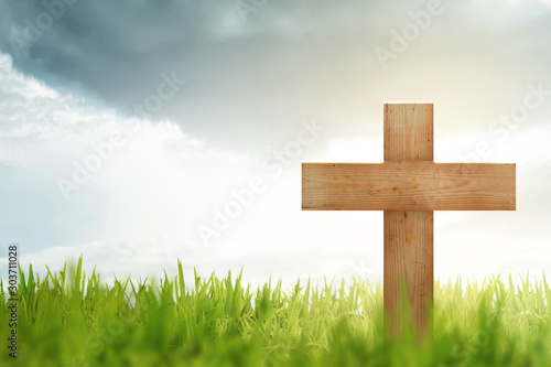 Christian cross on the green grass
