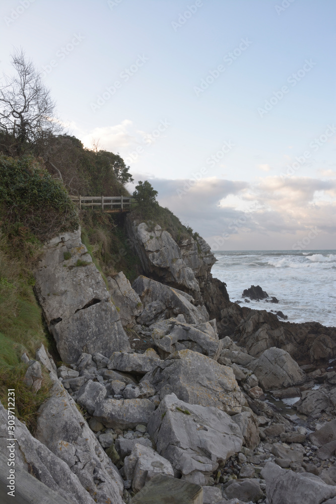 Waves beating against the rocks at Vidiago beach in Asturias