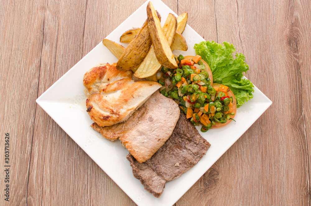 meat, chicken, beef and pork mix accompanied by vegetables meat, chicken, beef and pork mix accompanied by vegetables