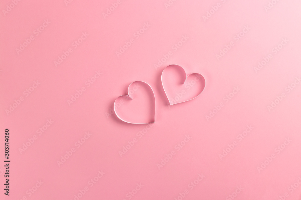 Composition for Valentine's Day February 14th. Delicate pink background and pink hearts cut out of paper. Greeting card. Flat lay, top view, copy space. Composition for Valentine's Day February 14th. Delicate pink background and pink hearts cut out of paper. Greeting card. Flat lay, top view, copy space.