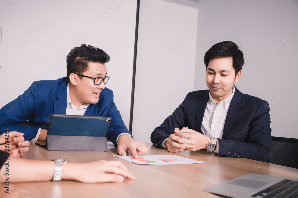 Teamwork with business people analysis cost graph in meeting room Teamwork with business people analysis cost graph in meeting room
