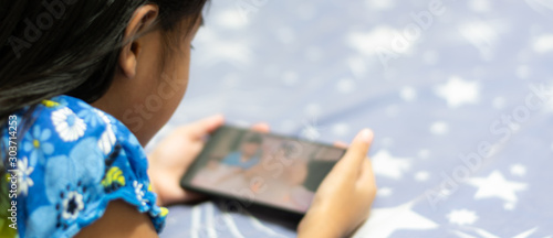 Children's concepts of technology and communication - girls using their smart phones with copy space