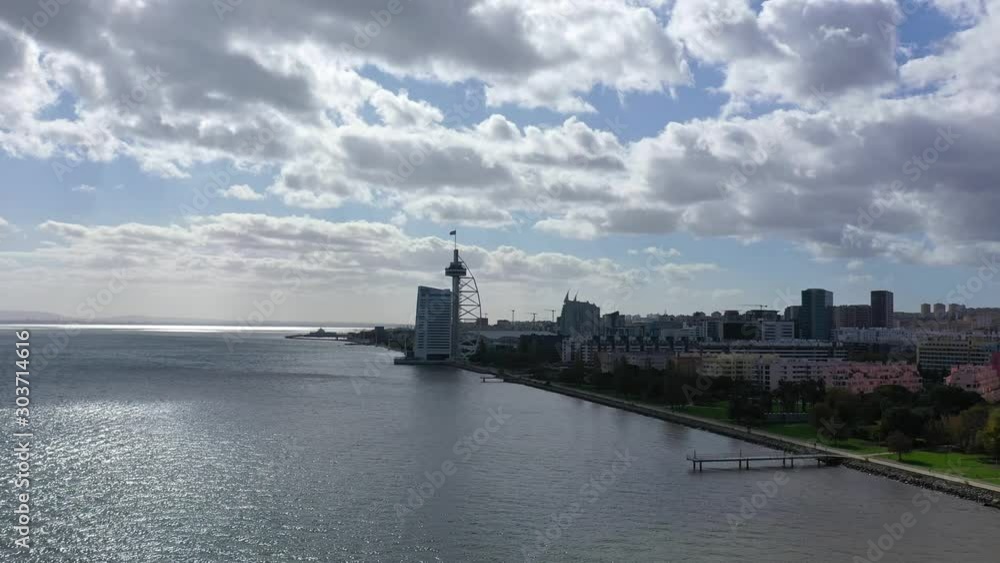 Aerial view over Vasco Da Gama Bridge in Lisbon - aerial drone footage Aerial view over Vasco Da Gama Bridge in Lisbon - aerial drone footage