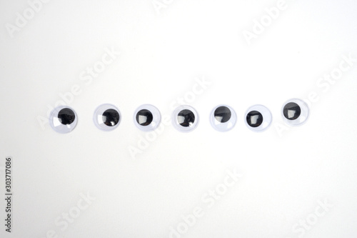 Pile of googly eyes sticker in a row - isolated white background