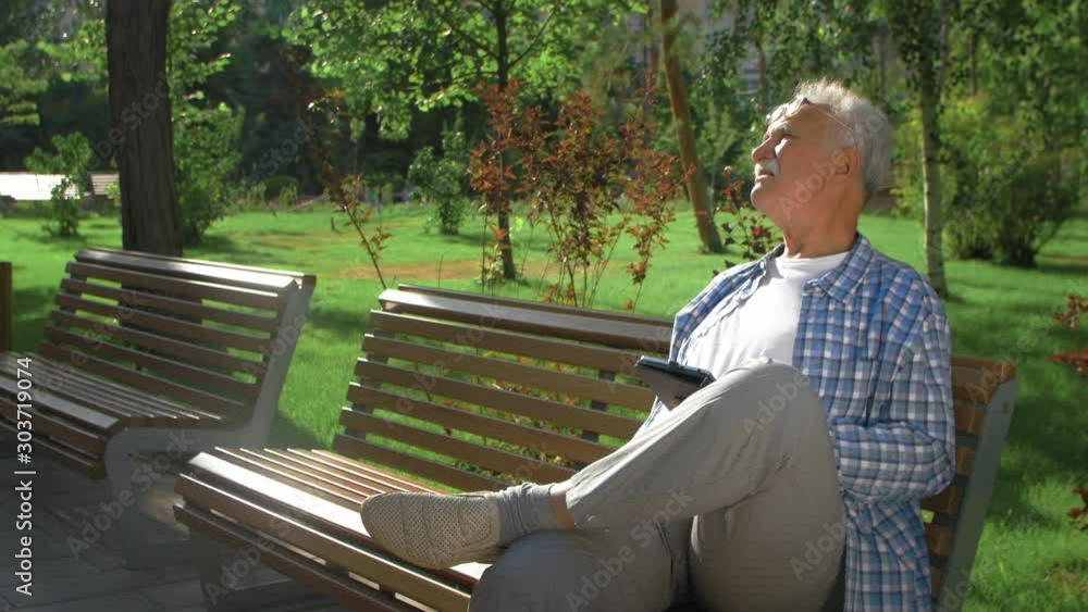 Elderly man don't understand how to use tablet computer Elderly man don't understand how to use tablet computer