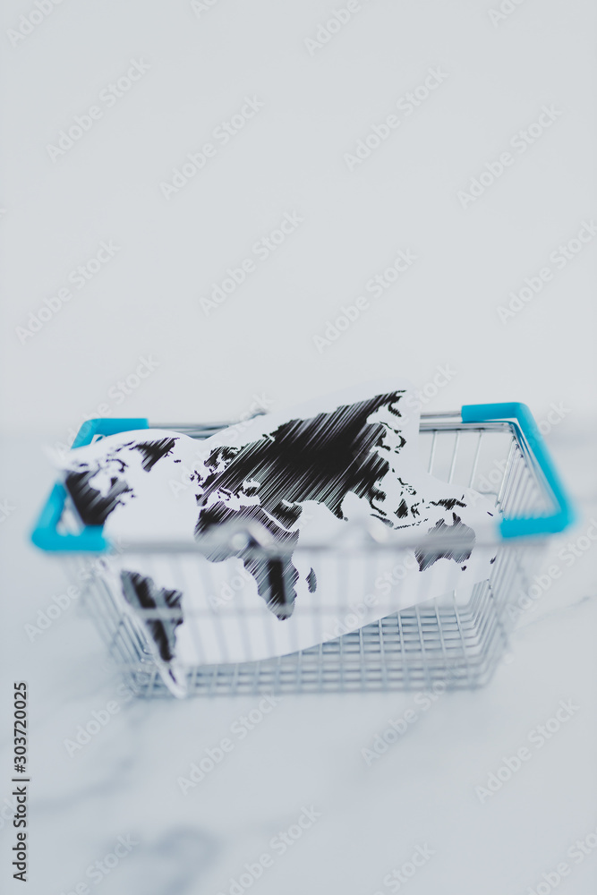 global business conceptual still-life, shopping basket with world map inside of it global business conceptual still-life, shopping basket with world map inside of it