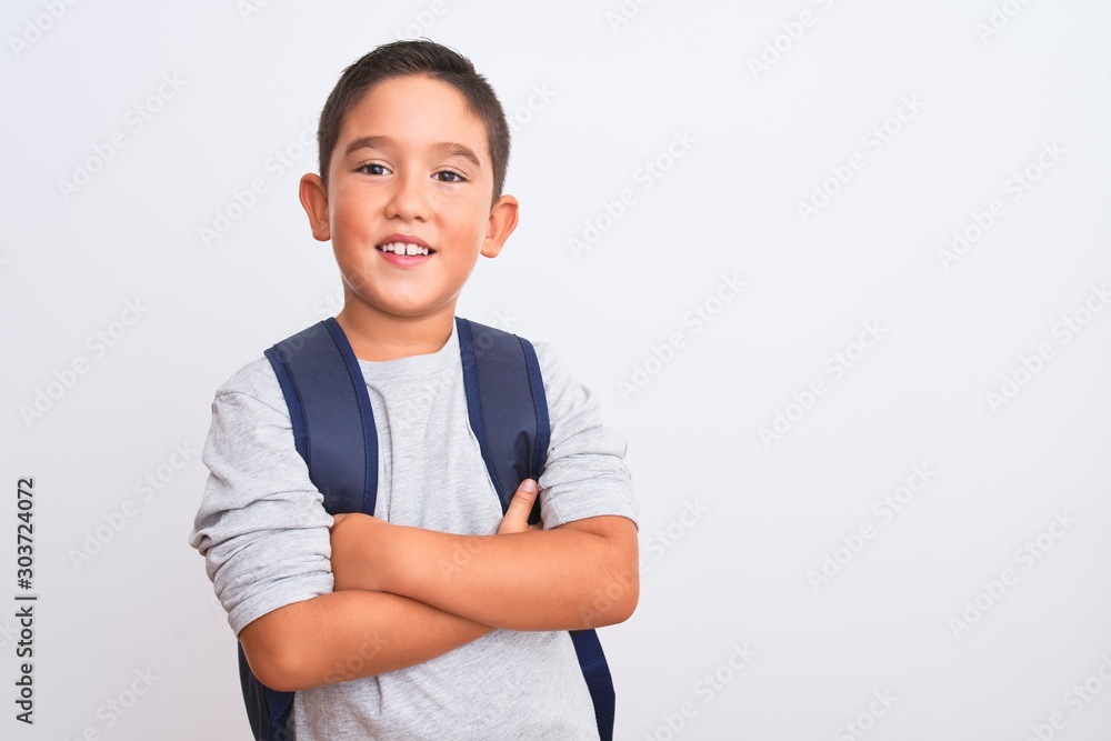 Beautiful student kid boy wearing backpack standing over isolated white background happy face smiling with crossed arms looking at the camera. Positive person. Beautiful student kid boy wearing backpack standing over isolated white background happy face smiling with crossed arms looking at the camera. Positive person.