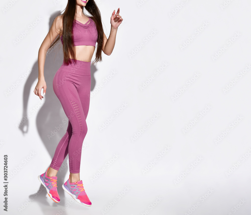 Beautiful young jogging woman. Isolated over white background. Beautiful young jogging woman. Isolated over white background.