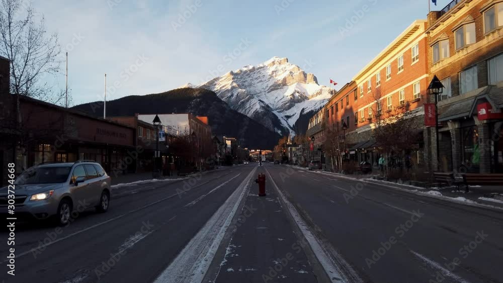 Downtown Banff, Alberta sits beneath Cascade Mountain at dusk Downtown Banff, Alberta sits beneath Cascade Mountain at dusk