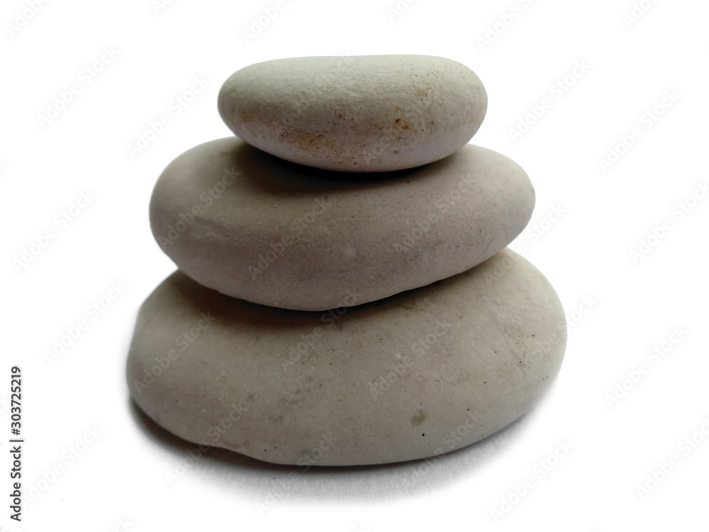 pile of stones isolated on white background. zen stone for spa background. three zen stones isolated on white background. pile of stones isolated on white background. zen stone for spa background. three zen stones isolated on white background.