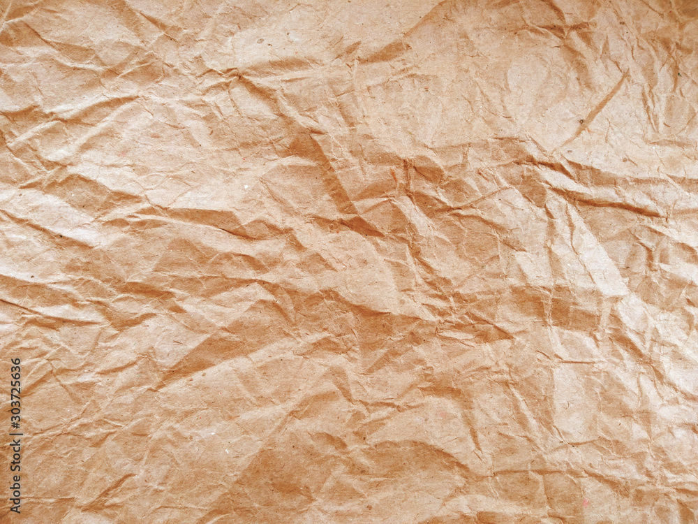 Crumpled paper ball isolated on white background. Crumpled paper texture. Brown crumpled paper texture for background. Crumpled paper ball isolated on white background. Crumpled paper texture. Brown crumpled paper texture for background.