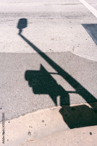 shadow on ground from street light