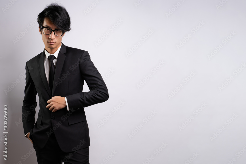 Portrait of a confident businessman standing isolated over background Portrait of a confident businessman standing isolated over background