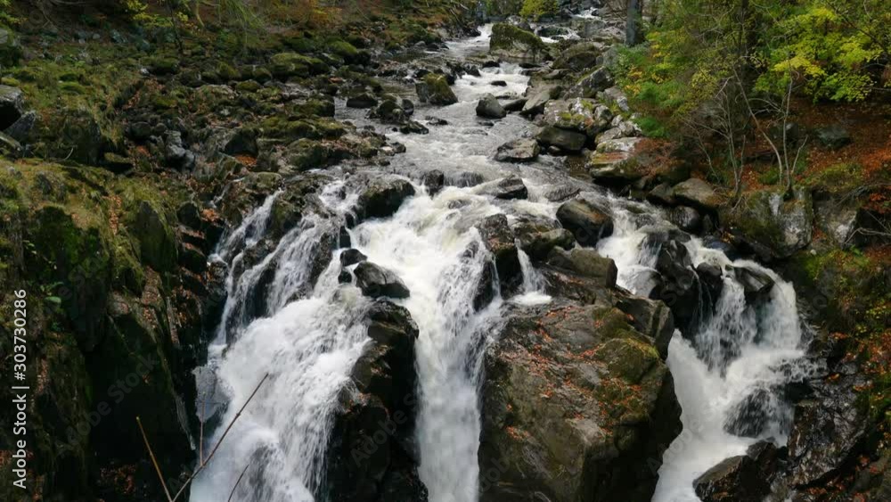 Golden Hour Green Foliage with Rocks, River and Waterfall, Pan Golden Hour Green Foliage with Rocks, River and Waterfall, Pan