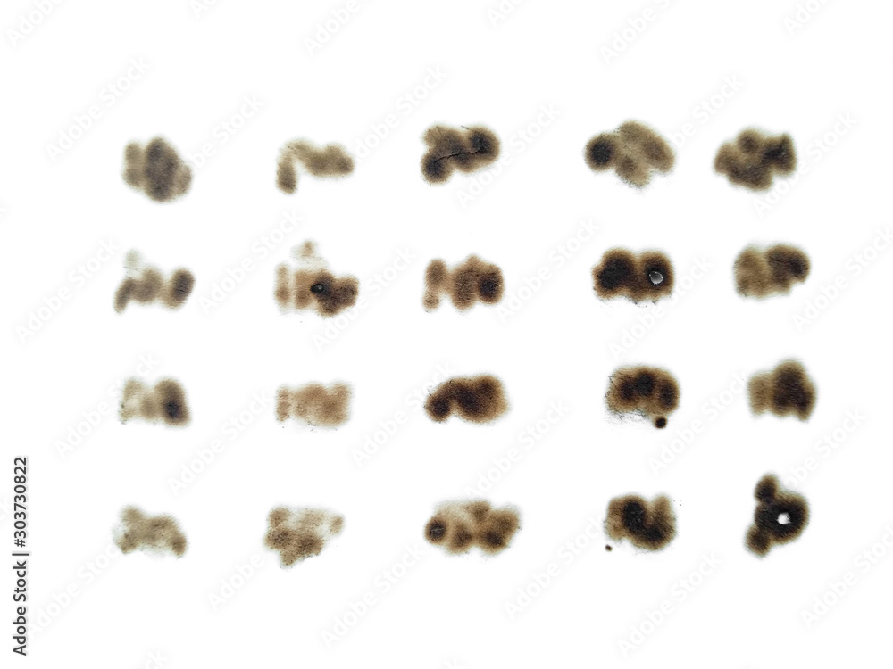 Collection of burnt holes in a piece of paper isolated on white background. Fire holes in white paper.