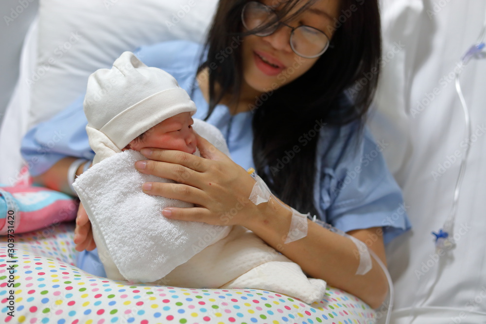 mother parenting, mom using hand help a baby newborn belch burping after breastfeeding milk mother parenting, mom using hand help a baby newborn belch burping after breastfeeding milk