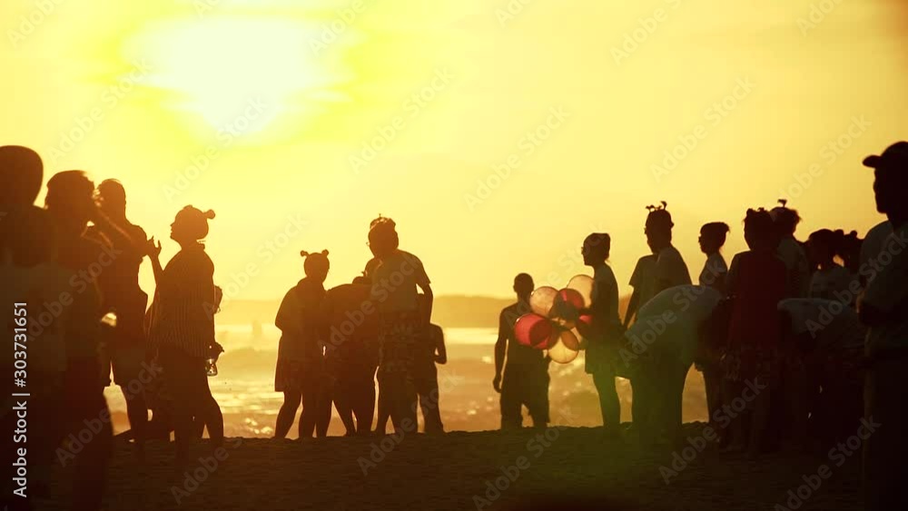 Slow motion silhouettes of a large group of tourists Slow motion silhouettes of a large group of tourists