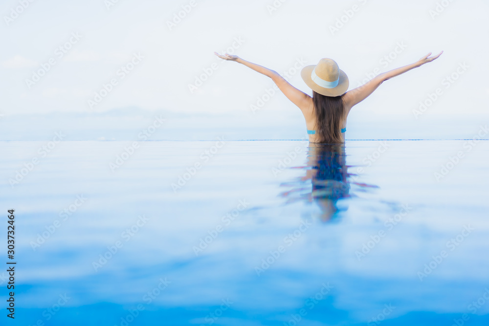 Portrait beautiful young asian women happy smile relax outdoor swimming pool in resort Portrait beautiful young asian women happy smile relax outdoor swimming pool in resort