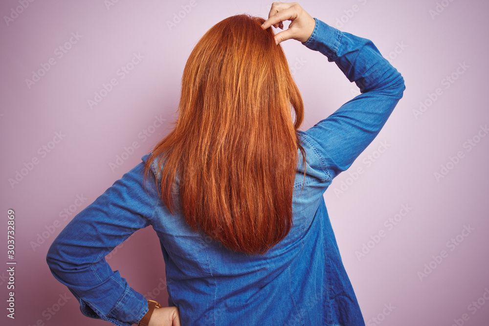Φωτογραφία Beautiful redhead woman wearing denim shirt and striped t-shirt over isolated pi