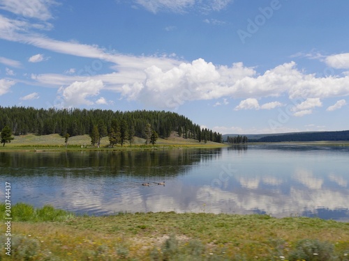 Yellowstone River with beautiful clouds reflected in the waters at the Yellowstone National Park, Wyoming.