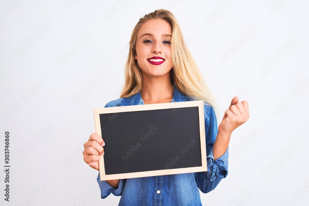 Young beautiful teacher woman holding blackboard standing over isolated white background screaming proud and celebrating victory and success very excited, cheering emotion Young beautiful teacher woman holding blackboard standing over isolated white background screaming proud and celebrating victory and success very excited, cheering emotion