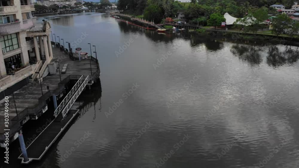 Cinematic aerial shot along the Sarawak River at Kuching Waterfront Cinematic aerial shot along the Sarawak River at Kuching Waterfront