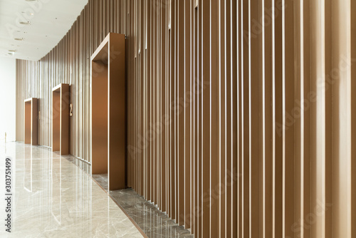 Detail of Random wooden strip wall in vertical direction at pre-function space