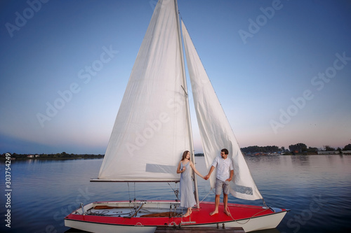 Young couple on board the yacht during a vacation