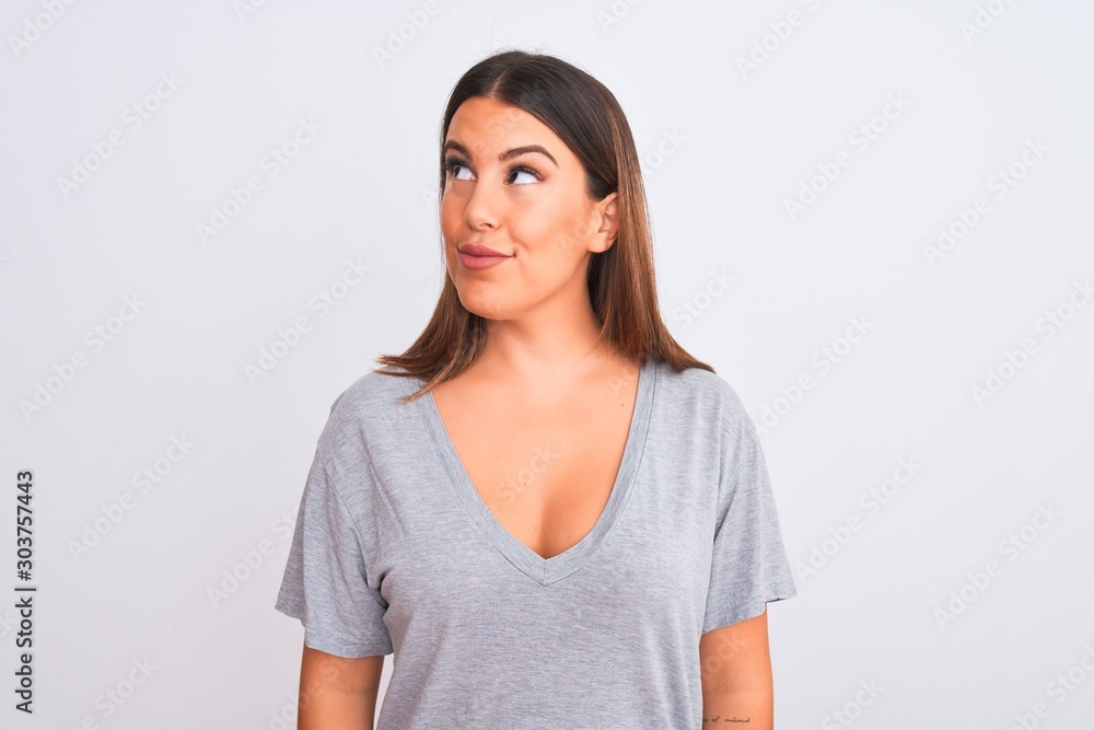 Portrait of beautiful young woman standing over isolated white background smiling looking to the side and staring away thinking. Portrait of beautiful young woman standing over isolated white background smiling looking to the side and staring away thinking.