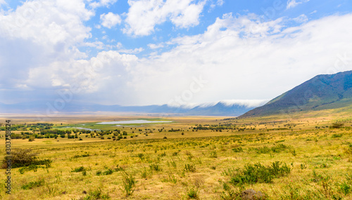 Panorama of Ngorongoro crater National Park with the Lake Magadi. Safari Tours in Savannah of Africa. Beautiful landscape scenery in Tanzania, Africa