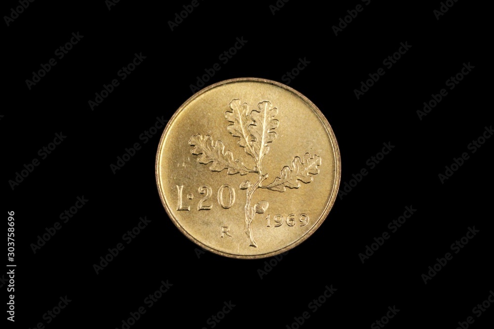 An old twenty French franc coin, shot close up in macro, on a black background An old twenty French franc coin, shot close up in macro, on a black background