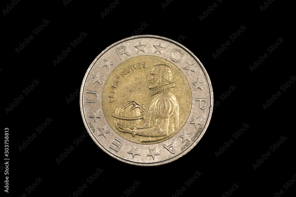 An old, bimettalic, one hundred escudo coin from Portugal, shot close up in macro on a black background An old, bimettalic, one hundred escudo coin from Portugal, shot close up in macro on a black background
