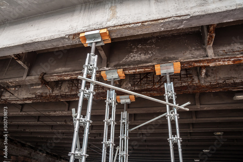 Heavy-duty pylons support a destroyed bridge beam