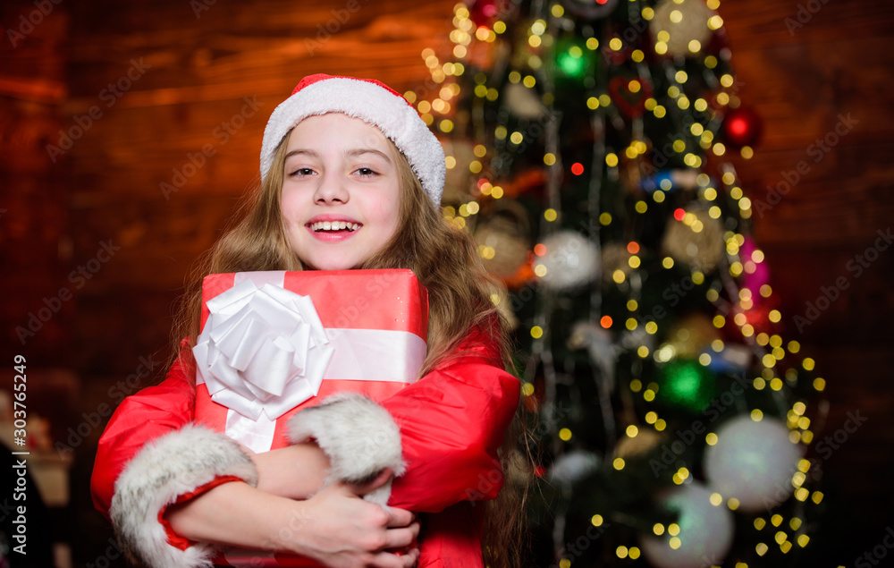 Winter holidays. Shopping and sale. Christmas is time for giving. Festive atmosphere christmas day. Girl santa claus costume hold christmas gift box. Prepare surprise gift. Open gift. Happy moments Winter holidays. Shopping and sale. Christmas is time for giving. Festive atmosphere christmas day. Girl santa claus costume hold christmas gift box. Prepare surprise gift. Open gift. Happy moments