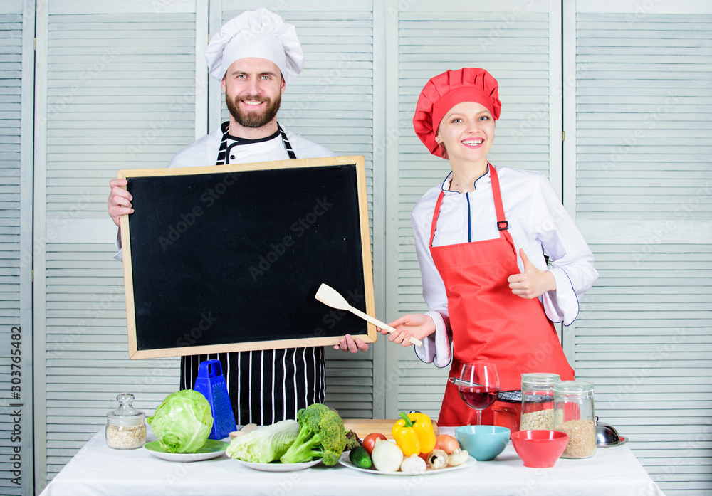 Woman and man chef hold blackboard copy space. Job position. Cooking ...