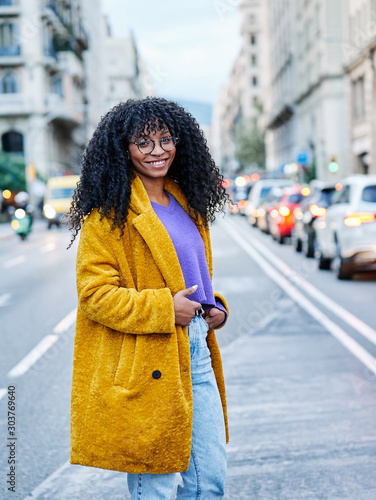 a young african american woman in the middle of Via Laietana, Barcelona