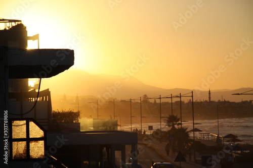 Yellow oil refinery at sunset