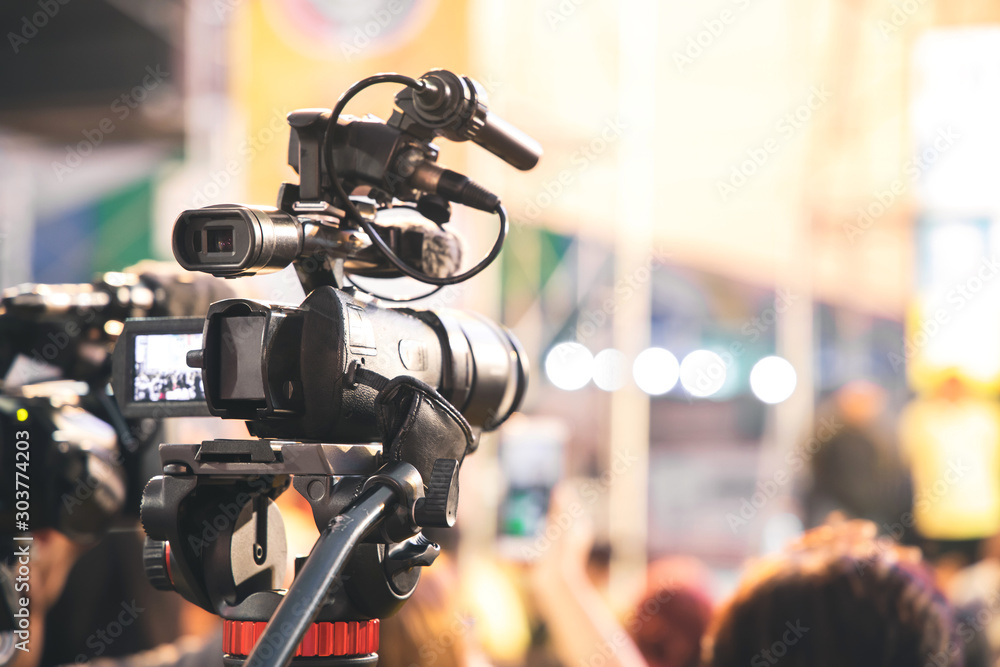 Professional video camera with abstract blurred background Professional video camera with abstract blurred background