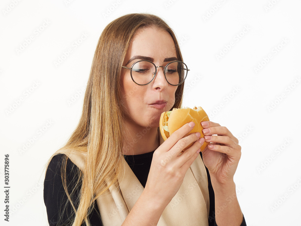 girl eating a burger on a white background