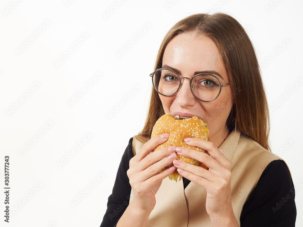 girl eating a burger on a white background girl eating a burger on a white background