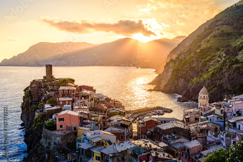 Vernazza - Village of Cinque Terre National Park at Coast of Italy. Beautiful colors at sunset. Province of La Spezia, Liguria, in the north of Italy - Travel destination and attraction in Europe. photo