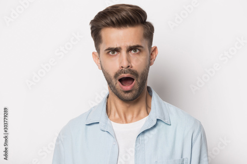 Close up portrait with scared handsome bearded man.