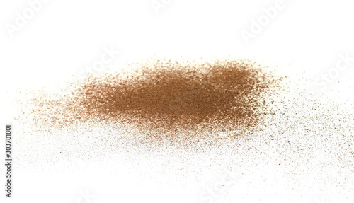 Spice cinnamon powder isolated on a white background. Cinnamon powder spilled on a white surface.