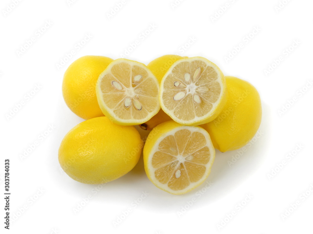 Heap of lemon. Juicy yellow slice of lemon on a white background isolated. Cut lemon fruits isolated on white background.